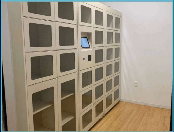 Installed asset and storage locker bank with glass doors and touchscreen kiosk
