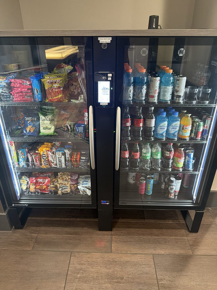 Zen Lockers AI smart-checkout cooler installed at a Houston property
